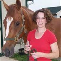 Dr. Lisa Tedora with a horse.
